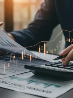 Person reviewing tax documents with a calculator, symbolizing financial planning and tax optimization.