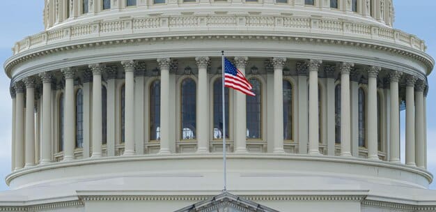 Image of two congressional leaders, one Republican and one Democrat, shaking hands in front of the Capitol Building, symbolizing the bipartisan effort behind the spending bill.
