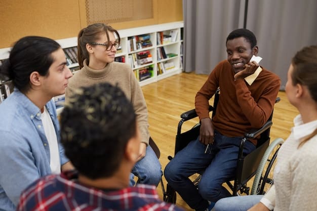 A teacher facilitating a group discussion among students with varying abilities and backgrounds. The students are expressing their ideas openly and respectfully. The classroom atmosphere is warm and encouraging.