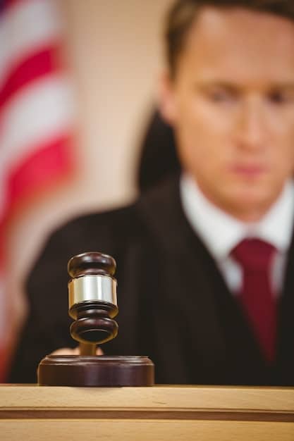 A gavel striking a sound block, symbolizing the authority and enforcement of regulations in the financial industry. The image should convey a sense of justice and the importance of regulatory compliance.