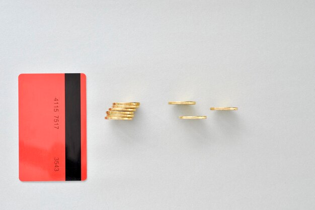 A close-up shot of a credit card with an overdue notice partially visible in the background, symbolizing the financial stress and struggle of consumers to meet their credit obligations.