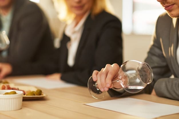 A close-up shot of a regulatory document with a gavel resting on top, with a blurred background of people in business attire discussing papers.
