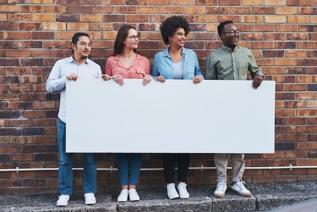A diverse group of people standing in front of a sign that says 