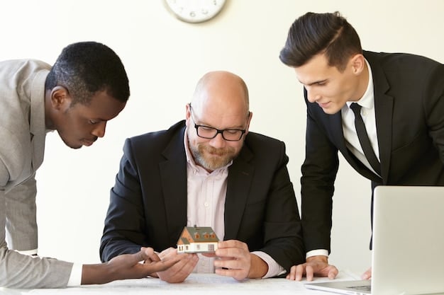A group of diverse people discussing forms and financial documents around a table, symbolizing estate planning and tax implications.